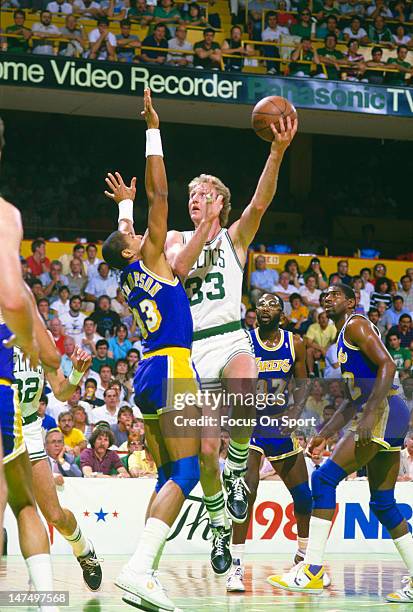 Larry Bird of the Boston Celtics shoots over Mychal Thompson of the Los Angeles Lakers during the NBA Finals June 1987 at The Boston Garden in Boston...