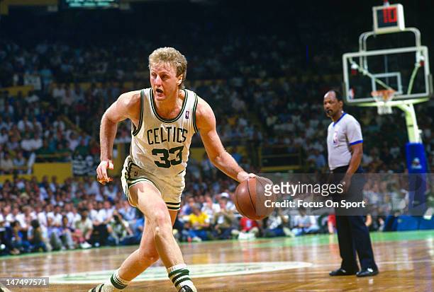 Larry Bird of the Boston Celtics dribbles the ball against the Los Angeles Lakers during the NBA Finals June 1987 at The Boston Garden in Boston...