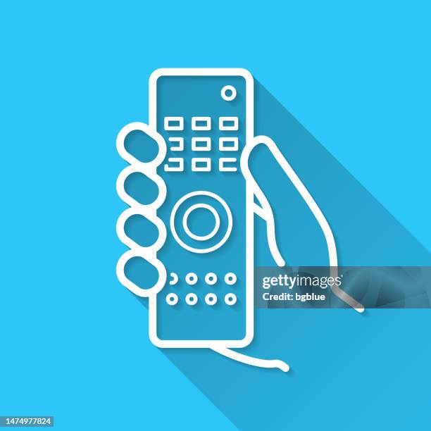 hand holding remote control. icon on blue background - flat design with long shadow - holding remote control stock illustrations