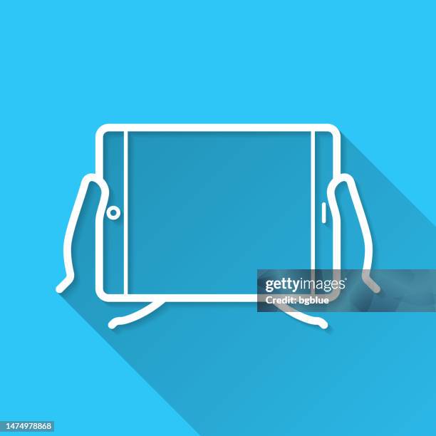hands holding tablet pc. icon on blue background - flat design with long shadow - using tablet blank screen stock illustrations