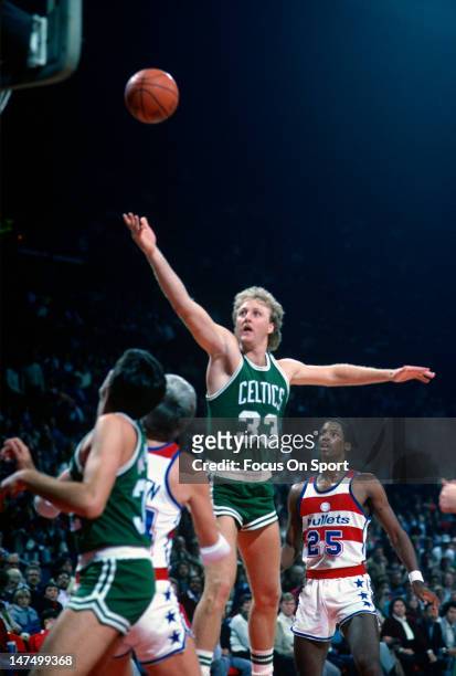 Larry Bird of the Boston Celtics lays the ball up against the Washington Bullets during an NBA basketball game circa 1985 at the Capital Center in...