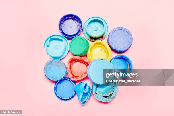 bottle caps found on the beach - bottle cap stock pictures, royalty-free photos & images
