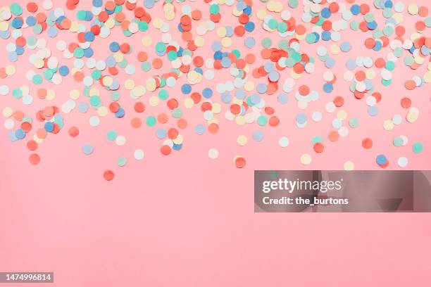 colorful confetti on pink background - abstract dots stock pictures, royalty-free photos & images