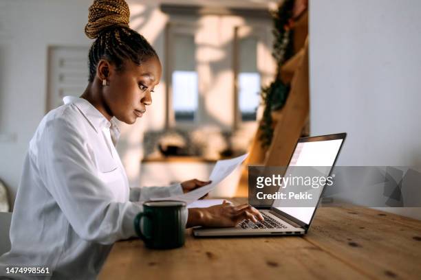 busy businesswoman working from home - financial planning stock pictures, royalty-free photos & images