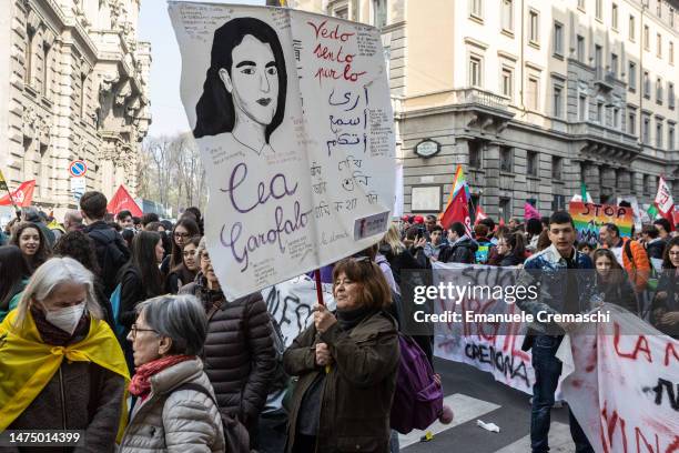 Woman holds a placard with the portrait of an Italian justice collaborator and victim of the 'Ndrangheta Lea Garofalo as they take part in a...