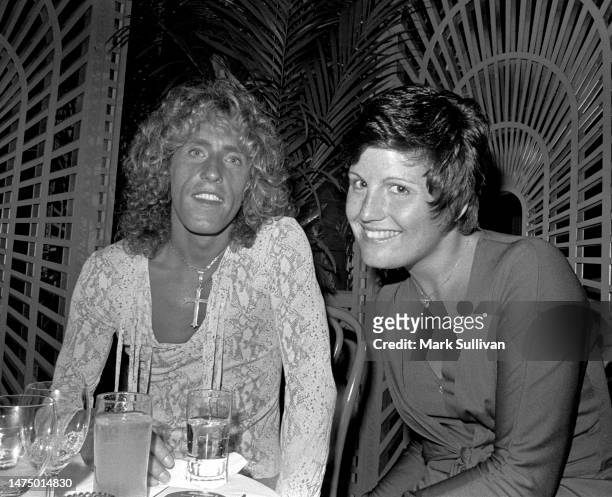 Singer Roger Daltrey and Actress Lucie Arnaz attend a party at the Bistro restaurant in Los Angeles, California, on August 11, 1975.