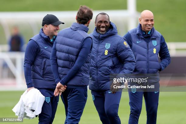 Jimmy Floyd Hasselbaink shares a joke with Gareth Southgate, Manager of England, and England coaching staff at St Georges Park on March 21, 2023 in...