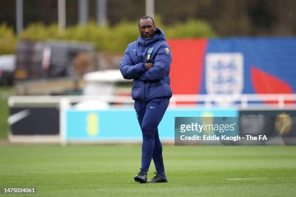 Jimmy Floyd Hasselbaink looks on during a training session at St George's Park on March 21, 2023 in Burton upon Trent, England.