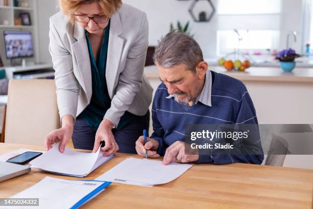 signing the will - notary stock pictures, royalty-free photos & images