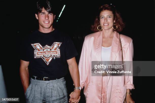 Tom Cruise and Mimi Rogers holding hands, United States, circa 1980s.
