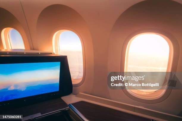 first class seat in commercial airplane - first class plane stock pictures, royalty-free photos & images