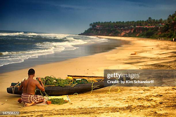 fisherman preparing boat - kerala surf stock pictures, royalty-free photos & images