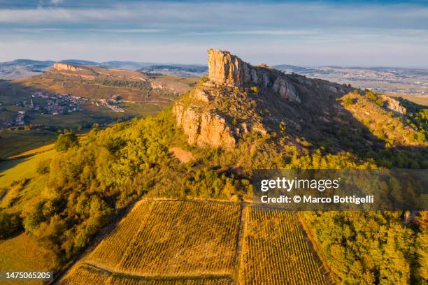 aerial view of rock of solutre at sunset, burgundy, france - escarpment stock pictures, royalty-free photos & images