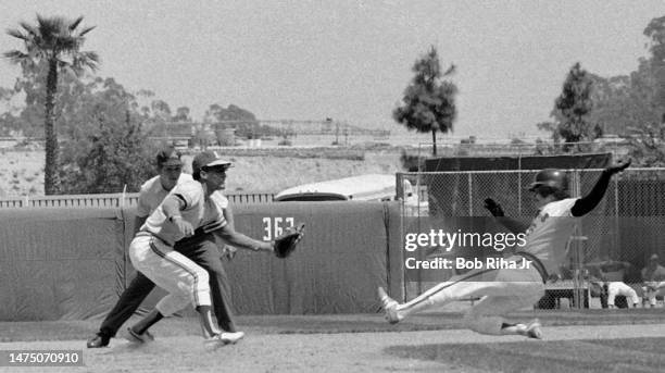 Oakland's Bert Campaneris awaits ball as Angels Ellie Rodriguez slides into second base during game between the California Angels and Oakland...