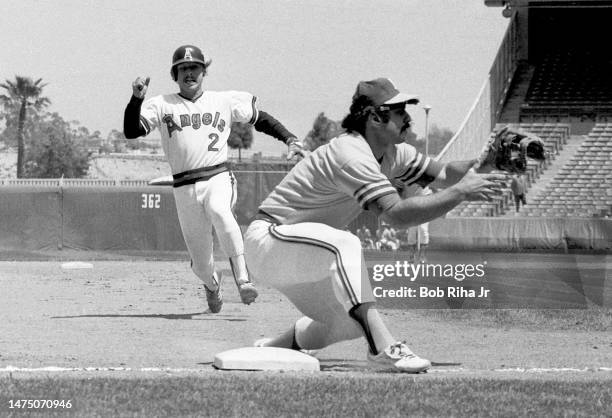 California Angels Jerry Remy slides into Third-Base and is tagged out by Oakland's Sal Bando during game between the California Angels and Oakland...