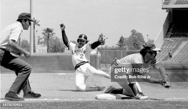 California Angels Jerry Remy slides into Third-Base and is tagged out by Oakland's Sal Bando during game between the California Angels and Oakland...