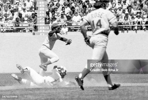 Dodgers Ron Cey is tagged out as he slides under Reds Dave Concepcion during game between Los Angeles Dodgers and the Cincinnati Reds, August 3, 1975...