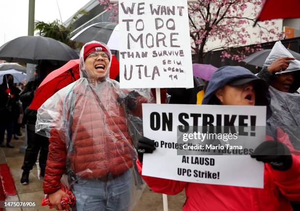 Mathematics teacher Robert Jong demonstrates in solidarity as Los Angeles Unified School District workers and supporters picket outside Robert F....