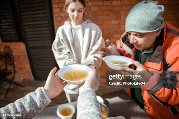 father and girl with hope and gratitude for some food - homelessness help stock pictures, royalty-free photos & images