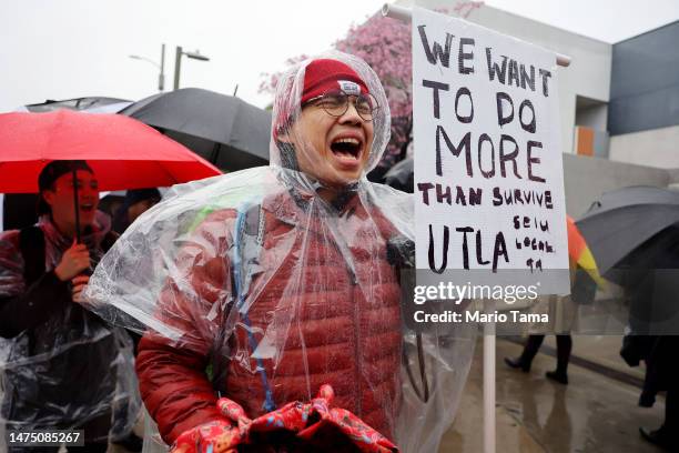 Mathematics teacher Robert Jong demonstrates in solidarity as Los Angeles Unified School District workers and supporters picket outside Robert F....