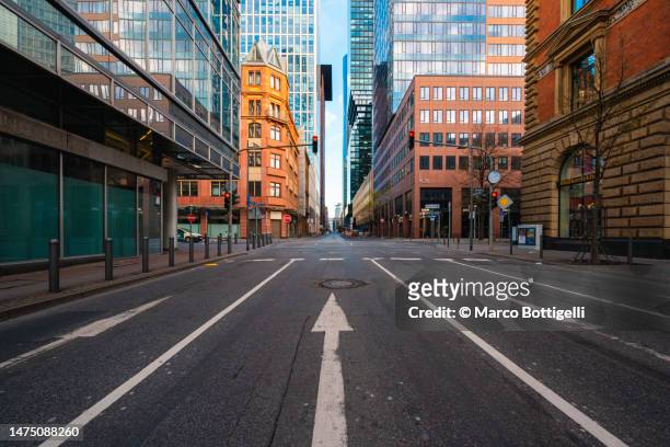 empty road in financial district in frankfurt, germany - high street banks stock pictures, royalty-free photos & images