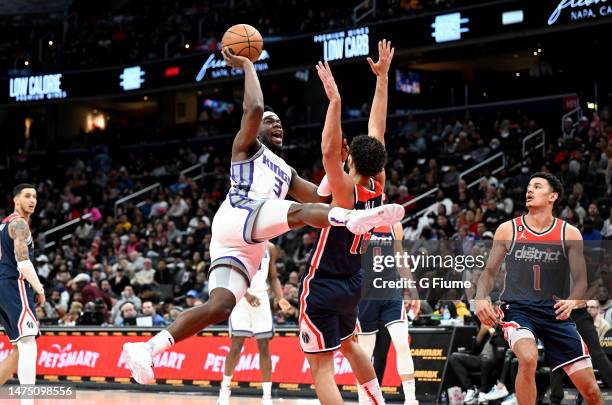 Terence Davis of the Sacramento Kings shoots the ball in the second quarter against Anthony Gill of the Washington Wizards at Capital One Arena on...