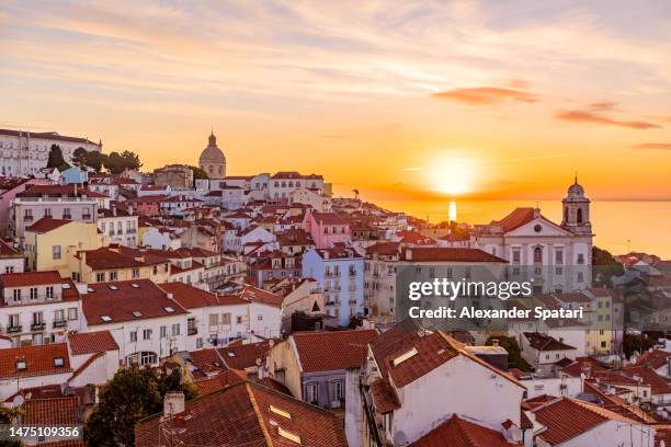 sunrise above alfama district in lisbon, portugal - alfama lisbon stock pictures, royalty-free photos & images