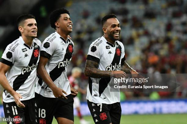 Alex Teixeira of Vasco celebrates with teammates after scoring the team's second goal with his teammates Andrey Santos and Gabriel Pec during the...