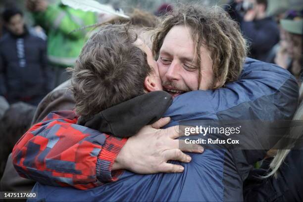 Friends embrace while joining celebrations at Stonehenge to mark the spring equinox on March 21, 2023 in Amesbury, England. Around 300 Druids, Pagans...