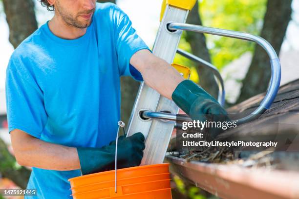 remember to clean your eavestroughs - clean house stockfoto's en -beelden