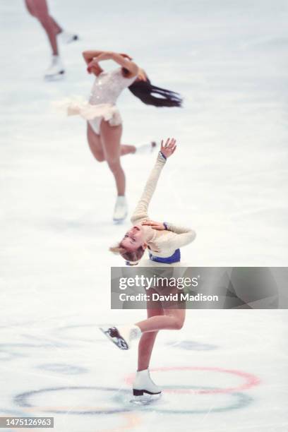 Tara Lipinski and Michelle Kwan perform in the exhibition program of the figure skating competition in the 1998 Winter Olympics held on February 21,...