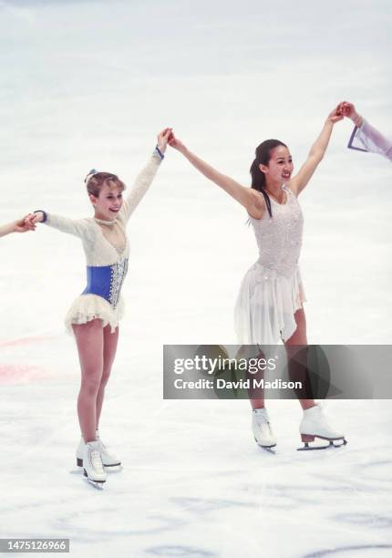 Tara Lipinski and Michelle Kwan perform in the exhibition program of the figure skating competition in the 1998 Winter Olympics held on February 21,...