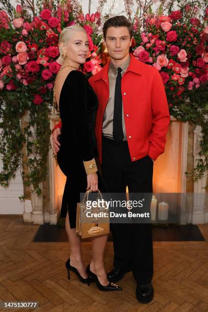 Pixie Lott and Oliver Cheshire attend a dinner to celebrate the opening of Schiaparelli at Harrods on March 21, 2023 in London, England.