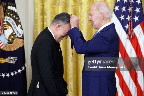 President Joe Biden awards singer Bruce Springsteen a 2021 National Medal of Art during a ceremony in the East Room of the White House on March 21,...