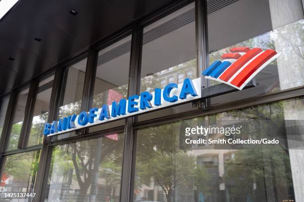Logo and sign on facade of Bank of America branch in Austin, Texas, March 11, 2023.