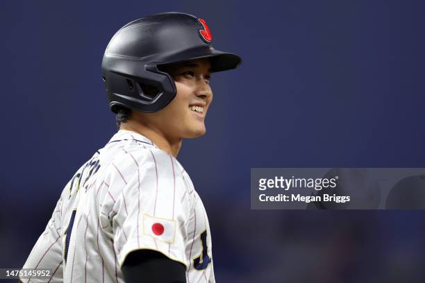 Shohei Ohtani of Team Japan walks to first base in the first inning against Team USA during the World Baseball Classic Championship at loanDepot park...