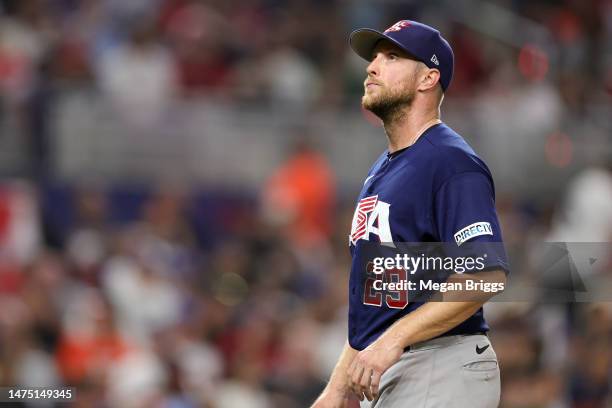 Merrill Kelly of Team USA walks to the dugout after being pulled in the second inning against Team Japan during the World Baseball Classic...