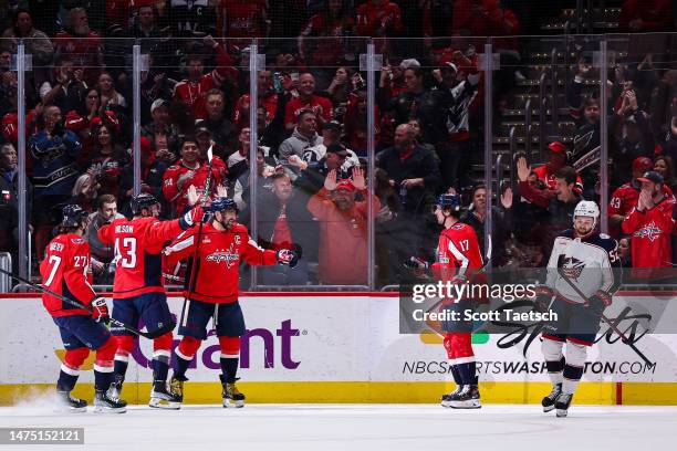 Alex Ovechkin of the Washington Capitals celebrates with teammates after scoring a goal against the Columbus Blue Jackets during the first period of...