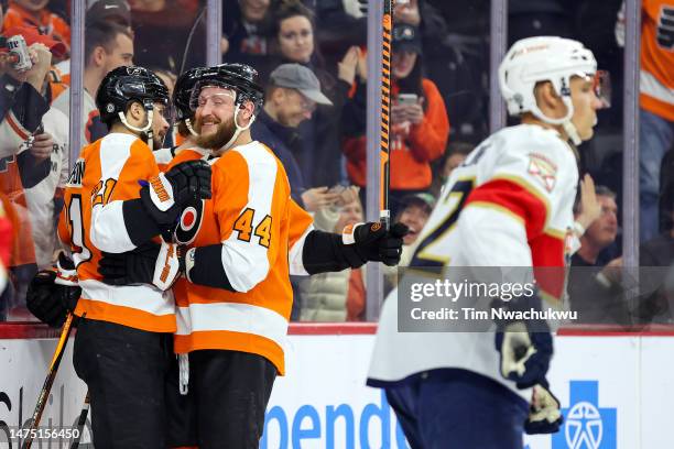 Scott Laughton and Nicolas Deslauriers of the Philadelphia Flyers react to a goal by Laughton during the second period against the Florida Panthers...