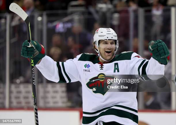 Marcus Foligno of the Minnesota Wild celebrates the win over the New Jersey Devils at Prudential Center on March 21, 2023 in Newark, New Jersey. The...
