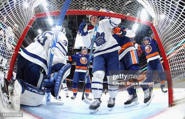 The New York Islanders celebrate a third period goal by Anders Lee against Ilya Samsonov of the Toronto Maple Leafs at the UBS Arena on March 21,...