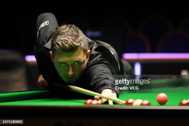Kyren Wilson of England plays a shot in the fourth round match against John Higgins of Scotland on day 6 of 2023 WST Classic at the Morningside Arena...