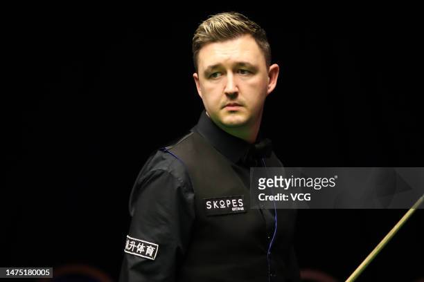 Kyren Wilson of England reacts in the fourth round match against John Higgins of Scotland on day 6 of 2023 WST Classic at the Morningside Arena on...