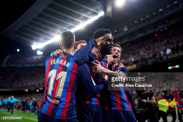 Franck Kessie of FC Barcelona celebrates with his teammates Ferran Torres and Sergi Roberto after scoring their team's second goal during the LaLiga...