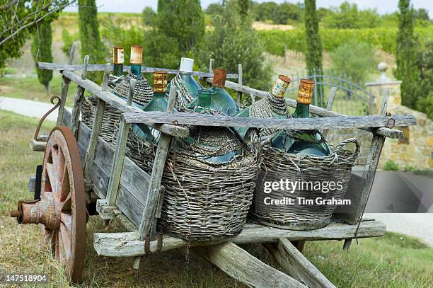 wine flagons farm cart montalcino, tuscany, italy - montalcino imagens e fotografias de stock