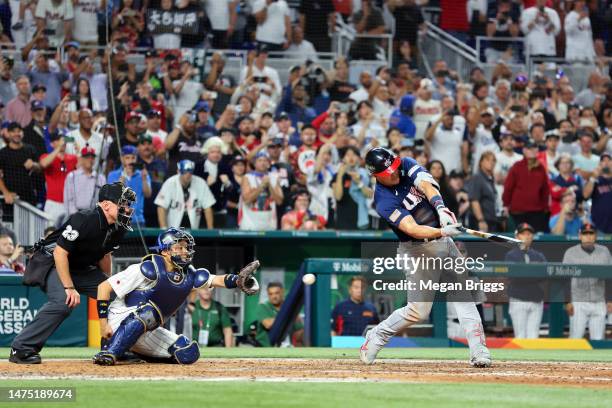 Mike Trout of Team USA strikes out during the ninth inning against Team Japan during the World Baseball Classic Championship at loanDepot park on...