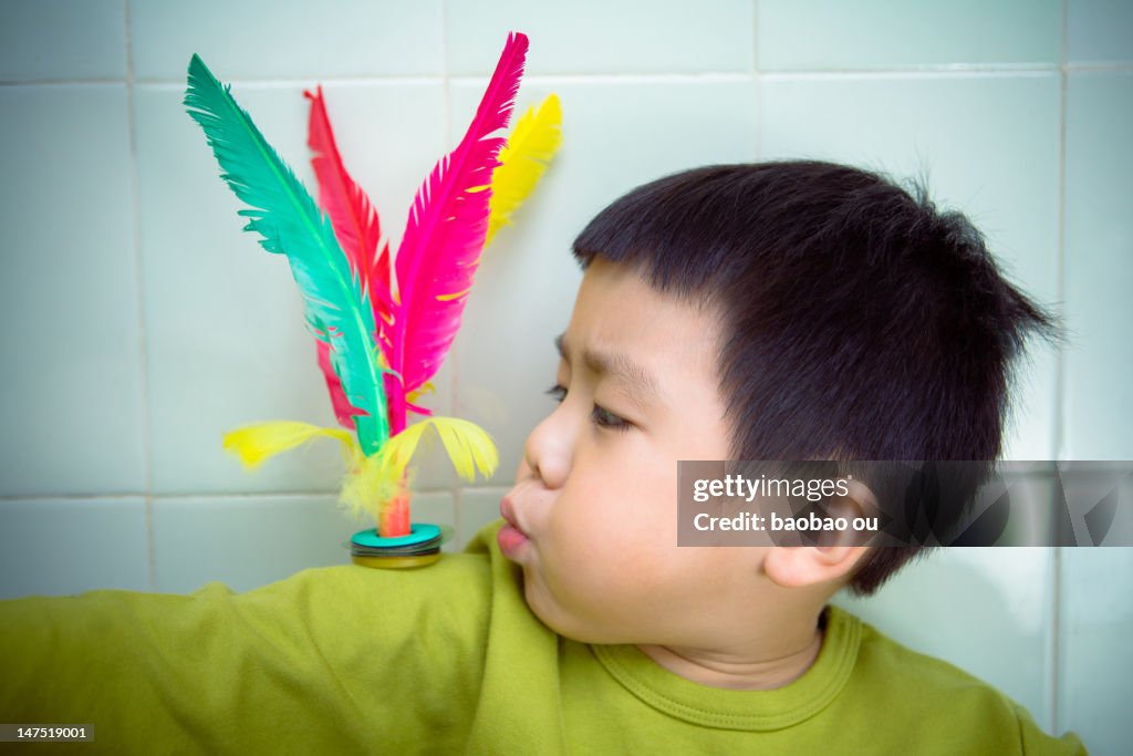 Boy blowing