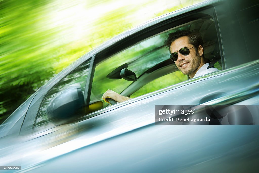 Middle aged man driving a car