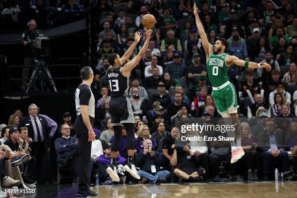 Keegan Murray of the Sacramento Kings shoots over Jayson Tatum of the Boston Celtics in the second half at Golden 1 Center on March 21, 2023 in...