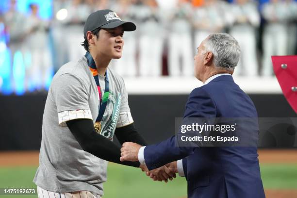 Shohei Ohtani of Team Japan is presented the medal after defeating Team USA during the World Baseball Classic Championship at loanDepot park on March...